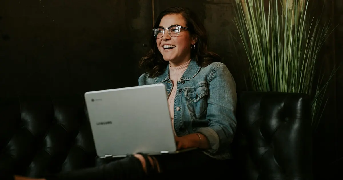 Silver laptop on woman's lap